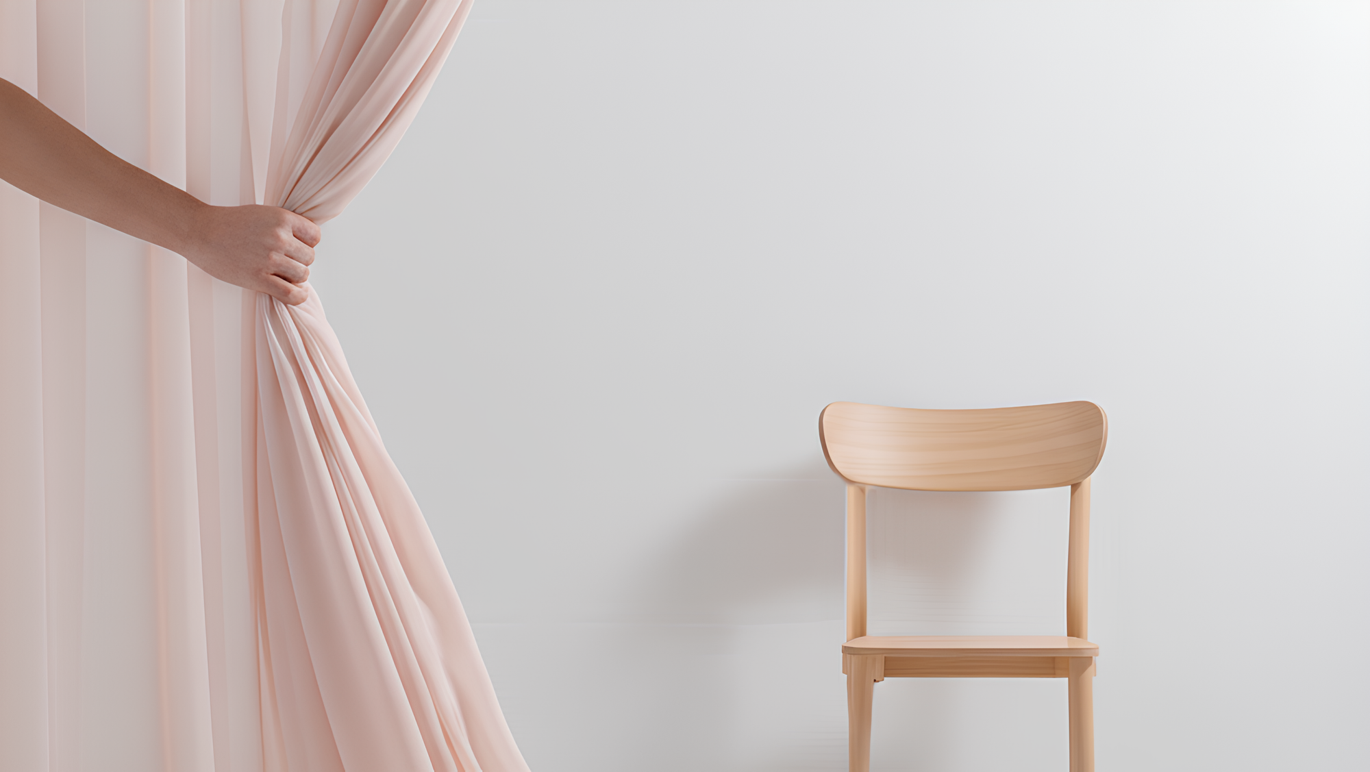 Close-up of light pink curtain being drawn in a minimal room with wooden chair